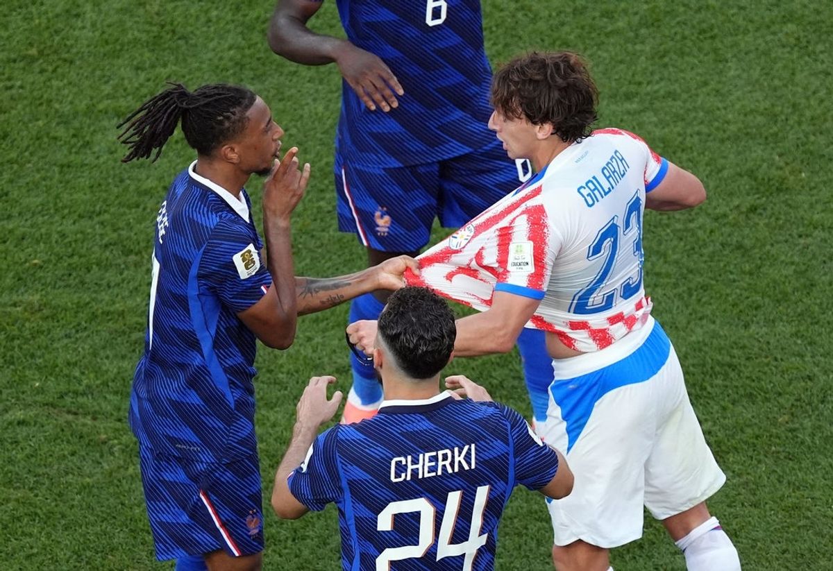 July 4, 2026; Philadelphia, Pennsylvania, U.S.; France's Michael Olise and Paraguay's Matias Galarza clash as Rayan Cherki reacts.  Mandatory Credit: Kyle Ross-Imagn Images