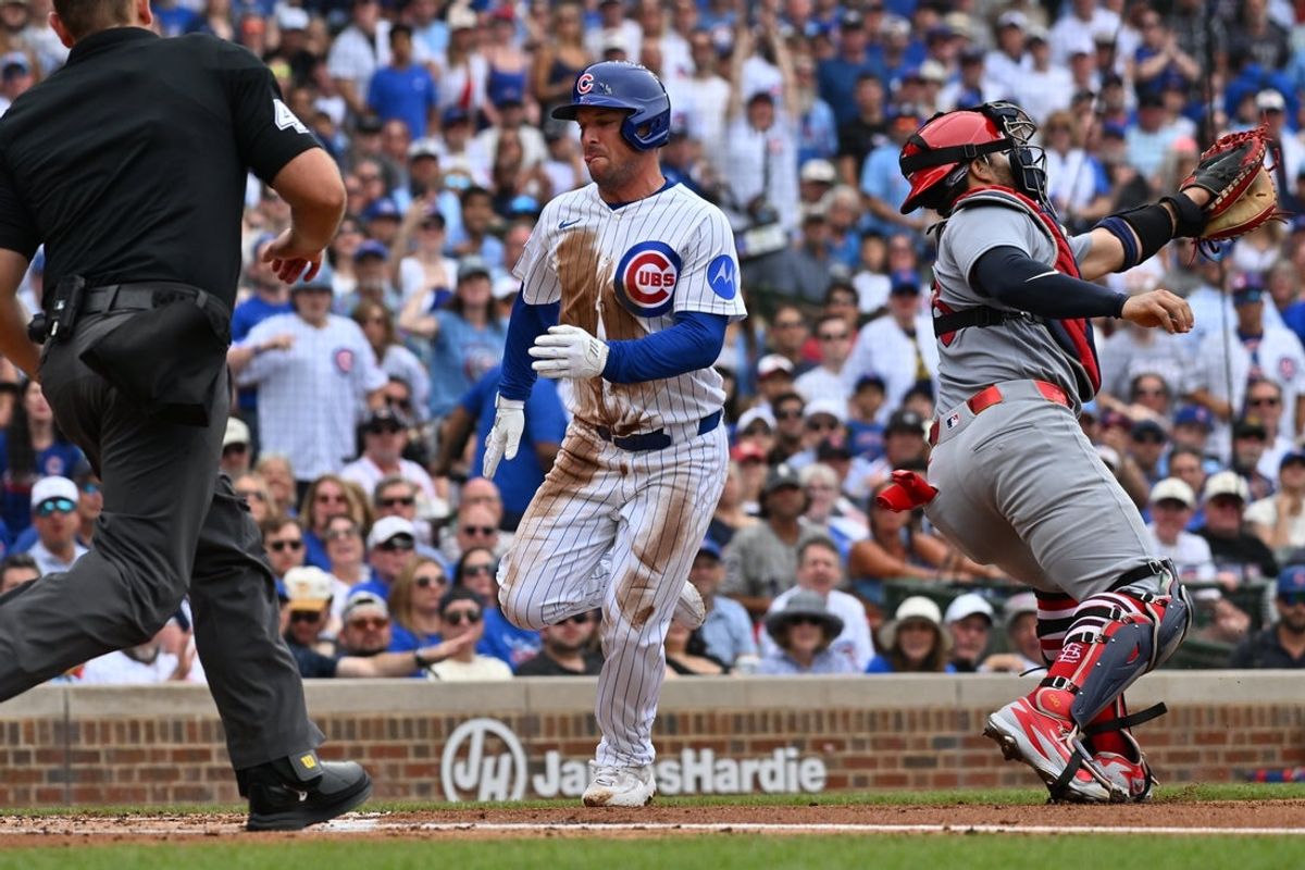 Jul 5, 2026; Chicago, Illinois, USA; Chicago Cubs third baseman Alex Bregman (3) scores against St. Louis Cardinals designated hitter Ivan Herrera (48) during the first inning at Wrigley Field. Mandatory Credit: Patrick Gorski-Imagn Images