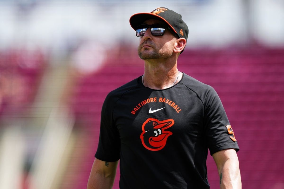 Jul 5, 2026; Cincinnati, Ohio, USA;  Baltimore Orioles manager Craig Albernaz walks to the dugout during a stop in play in the game against the Cincinnati Reds in the eighth inning at Great American Ball Park. Mandatory Credit: Aaron Doster-Imagn Images
