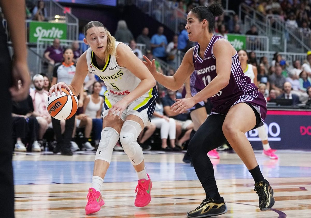 Jul 5, 2026; Toronto, Ontario, CAN; Dallas Wings guard Paige Bueckers (5) controls the ball as Toronto Tempo guard Kia Nurse (11) tries to defend during the second quarter at Coca-Cola Coliseum. Mandatory Credit: Nick Turchiaro-Imagn Images