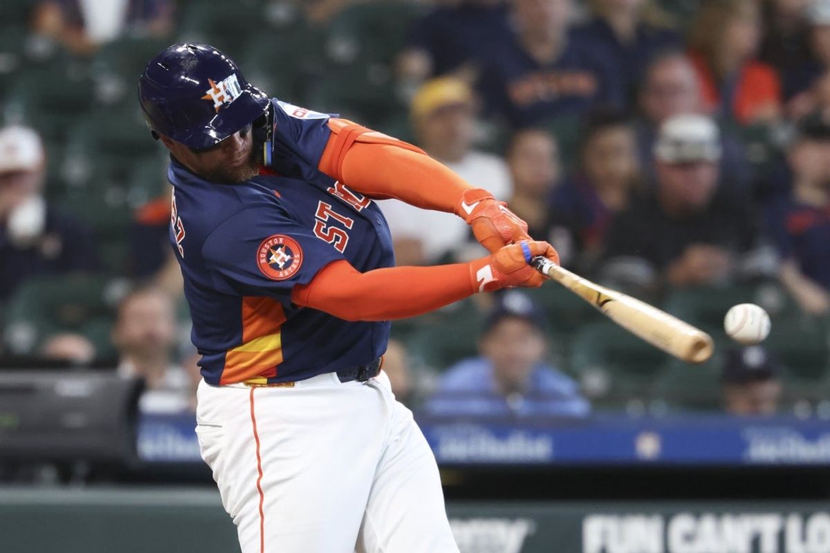Jul 5, 2026; Houston, Texas, USA; Houston Astros catcher Christian Vazquez  hits a single during the third inning against the Tampa Bay Rays at Daikin Park.