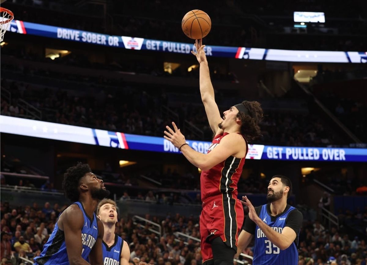 Dec 20, 2023; Orlando, Florida, USA; Miami Heat guard Jaime Jaquez Jr. (11) shoots a layup against the Orlando Magic during the first quarter at KIA Center.