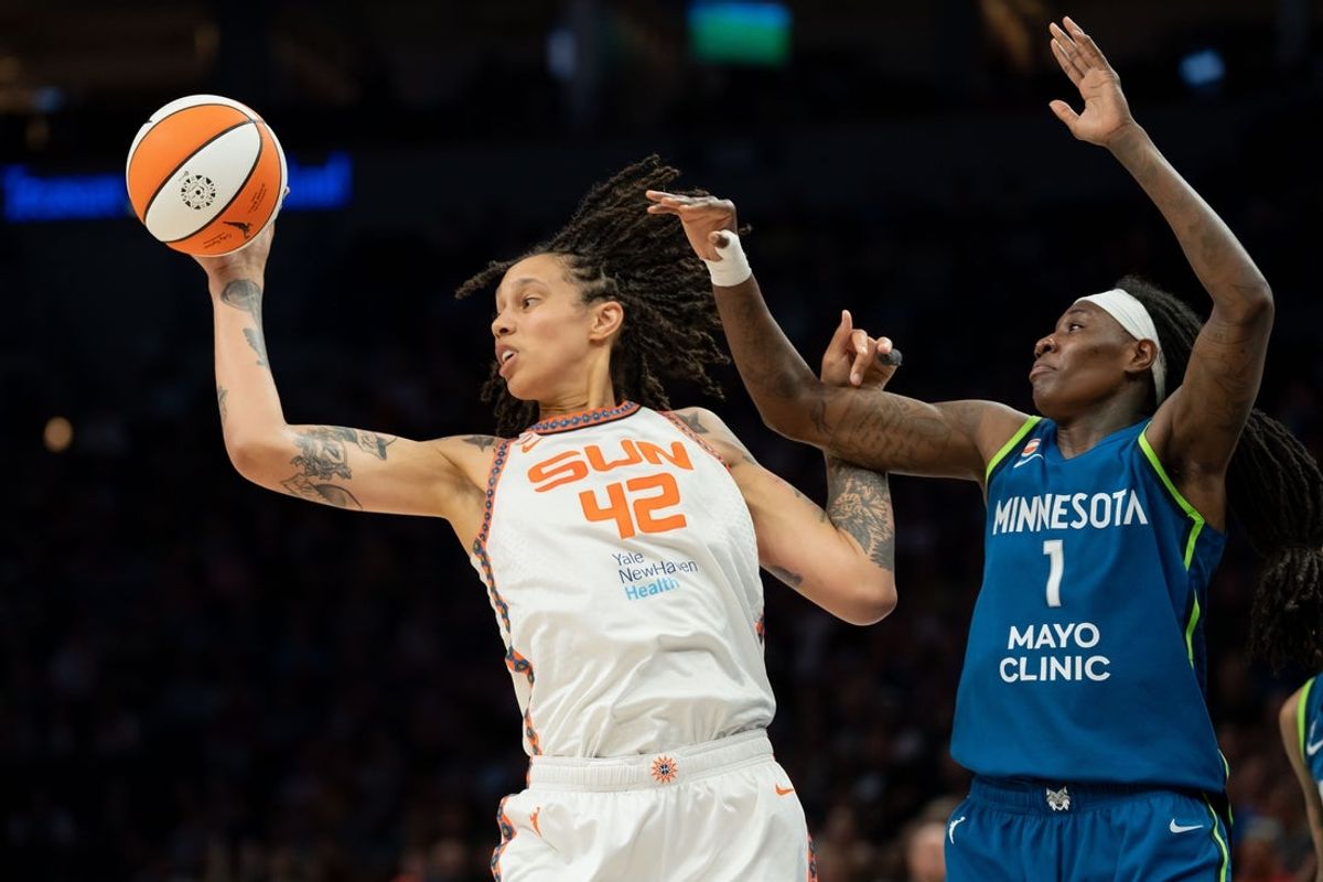 Jul 6, 2026; Minneapolis, Minnesota, USA; Connecticut Sun center Brittney Griner (42) jumps for a rebound in front of Minnesota Lynx forward Natasha Howard (1) in the second half at Target Center. Mandatory Credit: Jesse Johnson-Imagn Images