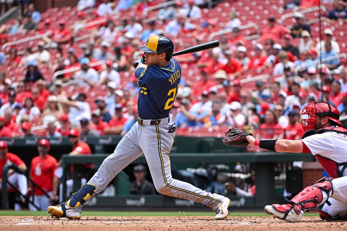 Jul 7, 2026; St. Louis, Missouri, USA; Milwaukee Brewers designated hitter Christian Yelich (22) hits a one run single against the St. Louis Cardinals during the third inning at Busch Stadium. Mandatory Credit: Jeff Curry-Imagn Images