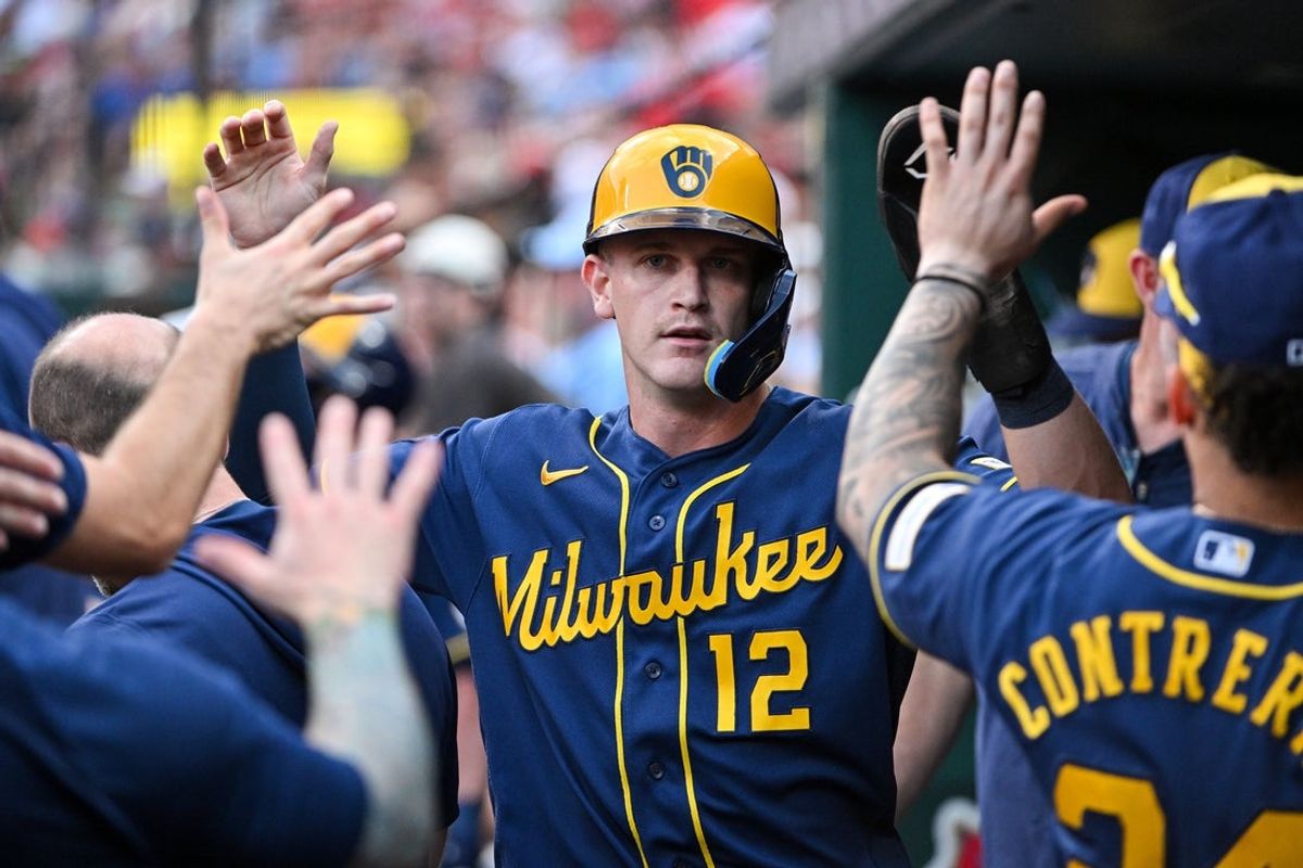 Jul 7, 2026; St. Louis, Missouri, USA; Milwaukee Brewers shortstop Cooper Pratt (12) is congratulated by teammates after scoring against the St. Louis Cardinals during the third inning at Busch Stadium. Mandatory Credit: Jeff Curry-Imagn Images