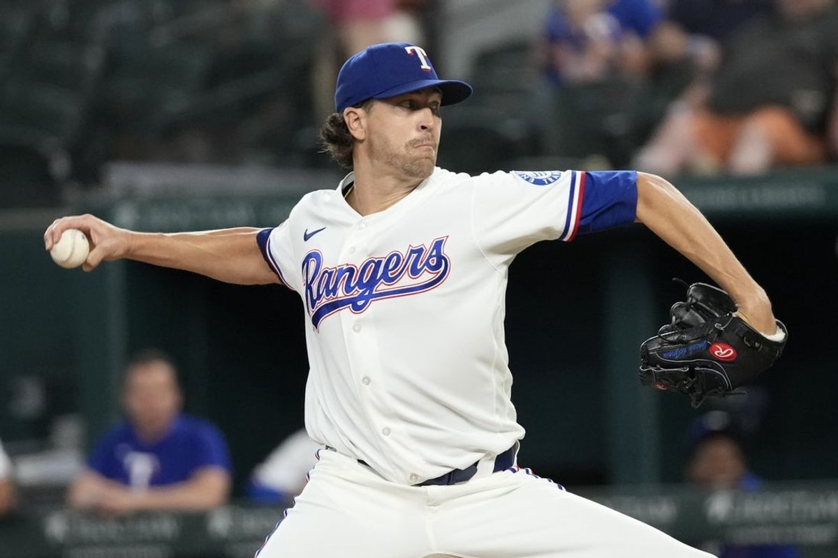 Jul 7, 2026; Arlington, Texas, USA; Texas Rangers starting pitcher Jacob deGrom (48) delivers a pitch to the Los Angeles Angels during the first inning at Globe Life Field. Mandatory Credit: Jim Cowsert-Imagn Images