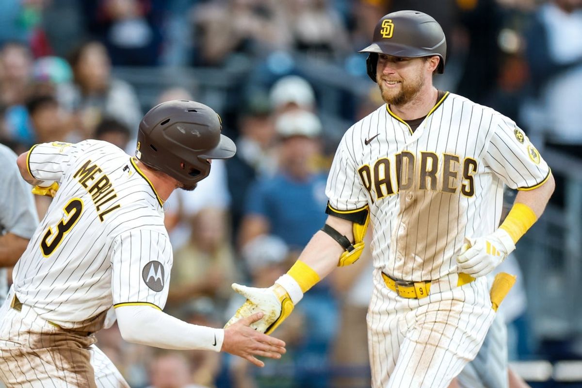 Jul 7, 2026; San Diego, California, USA; San Diego Padres first baseman Jake Cronenworth (9) celebrates with center fielder Jackson Merrill (3) after hitting a three-run home run during the first inning against the Arizona Diamondbacks at Petco Park. Mandatory Credit: David Frerker-Imagn Images