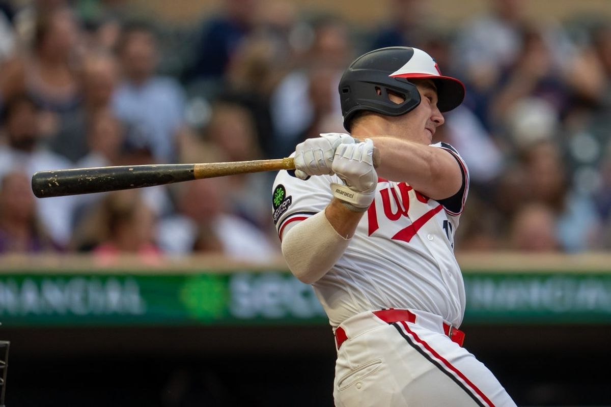 Jul 8, 2026; Minneapolis, Minnesota, USA; Minnesota Twins right fielder Alan Roden (18) hits a single against the Cleveland Guardians in the fourth inning at Target Field. Mandatory Credit: Jesse Johnson-Imagn Images