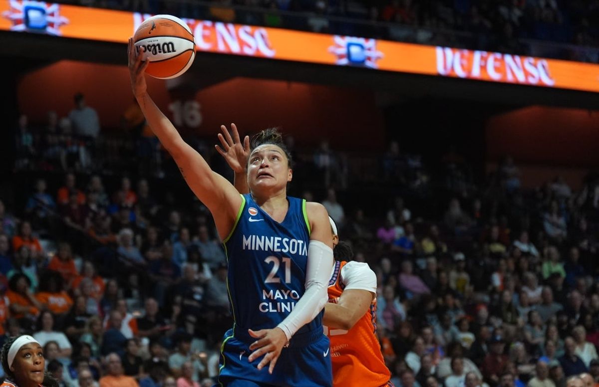 Jul 8, 2026; Uncasville, Connecticut, USA; Minnesota Lynx guard Kayla McBride (21) drives the ball to the basket against Connecticut Sun forward Nell Angloma (33) in the second half at Mohegan Sun Arena. Mandatory Credit: David Butler II-Imagn Images