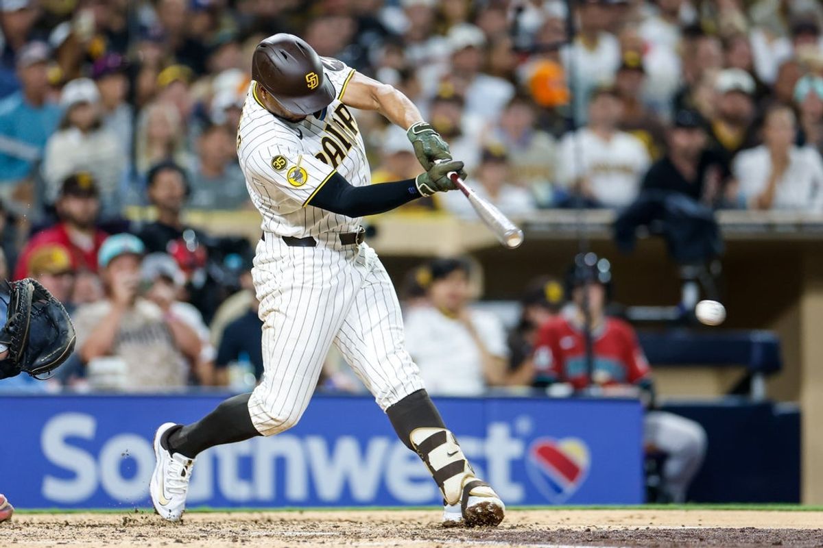 Jul 8, 2026; San Diego, California, USA; San Diego Padres shortstop Xander Bogaerts (2) hits a two-run single during the fifth inning against the Arizona Diamondbacks at Petco Park. Mandatory Credit: David Frerker-Imagn Images