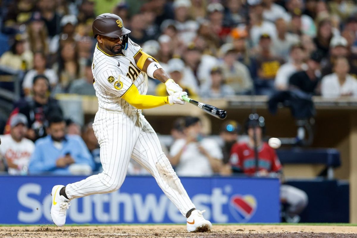 Jul 8, 2026; San Diego, California, USA; San Diego Padres designated hitter Miguel Andujar (41) hits a RBI double during the seventh inning against the Arizona Diamondbacks at Petco Park. Mandatory Credit: David Frerker-Imagn Images