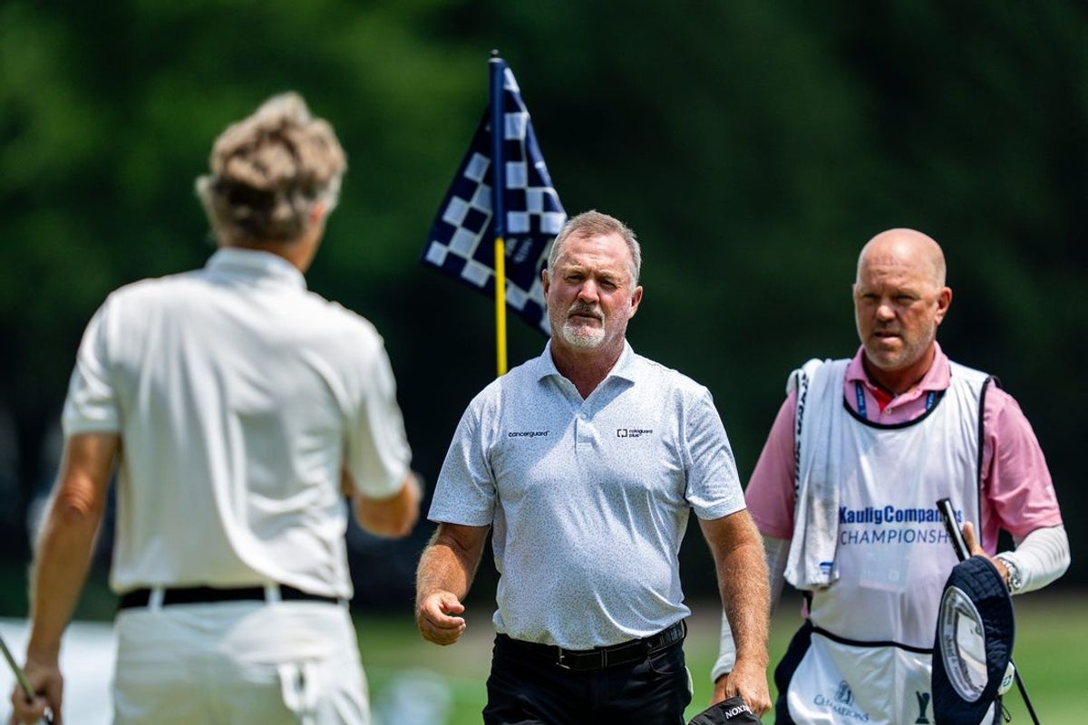 Jerry Kelly loos to shake hands with Bernhard Lange as they conclude round 1 of the Kaulig Companies PGA Championship, July 9, 2026, at Firestone Country Club in Akron, Ohio.