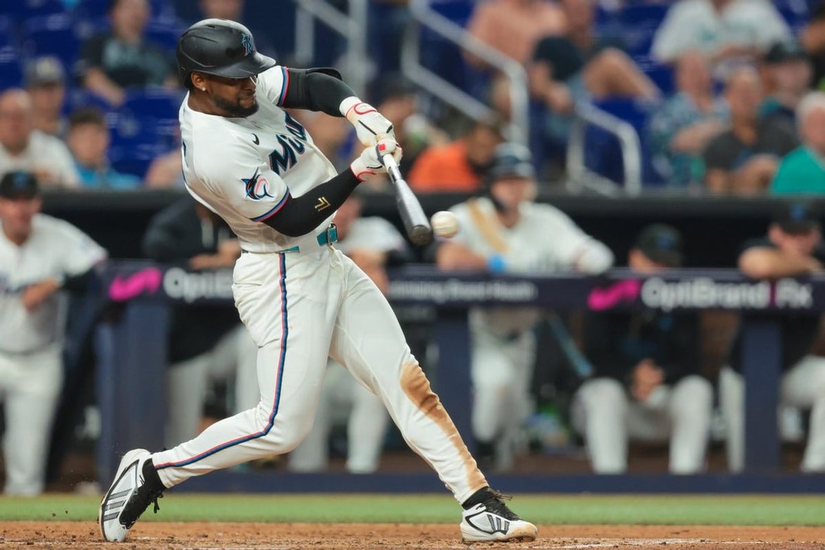 Jul 9, 2026; Miami, Florida, USA; Miami Marlins shortstop Otto Lopez (6) hits a two-run triple against the Seattle Mariners during the fourth inning at loanDepot Park. Mandatory Credit: Sam Navarro-Imagn Images