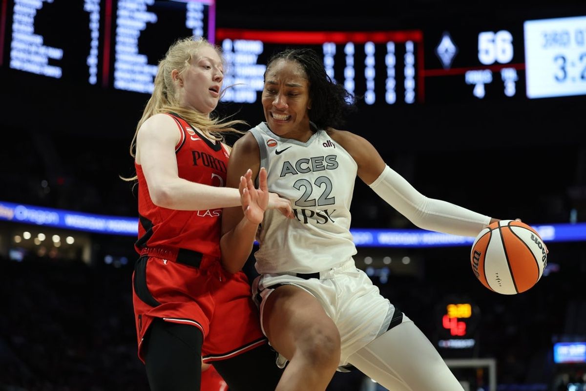 Jul 9, 2026; Portland, Oregon, USA; Las Vegas Aces center A'ja Wilson (22) posts up against Portland Fire forward Frieda Buhner (20) during the second half at Moda Center. Mandatory Credit: Soobum Im-Imagn Images