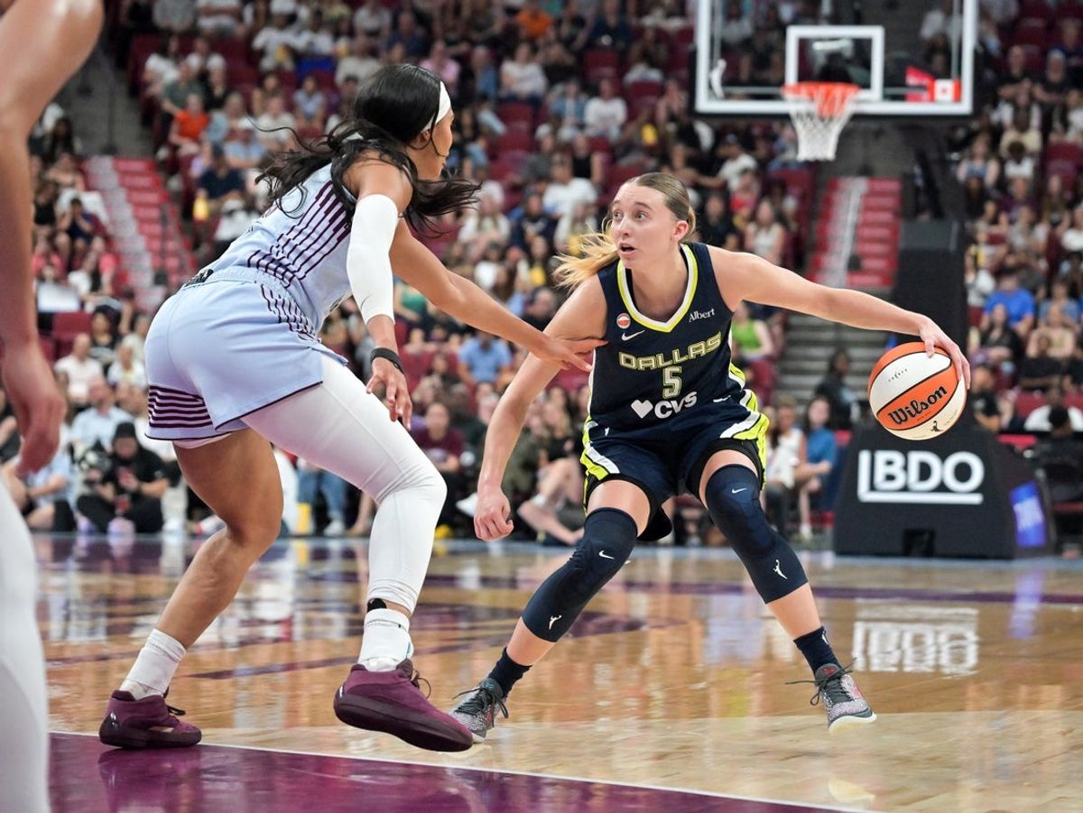 Jul 10, 2026; Montreal, Quebec, CAN; Dallas Wings guard Paige Bueckers (5) and Toronto Tempo forward Isabelle Harrison (21) in the first half at the Bell Centre. Mandatory Credit: Eric Bolte-Imagn Images