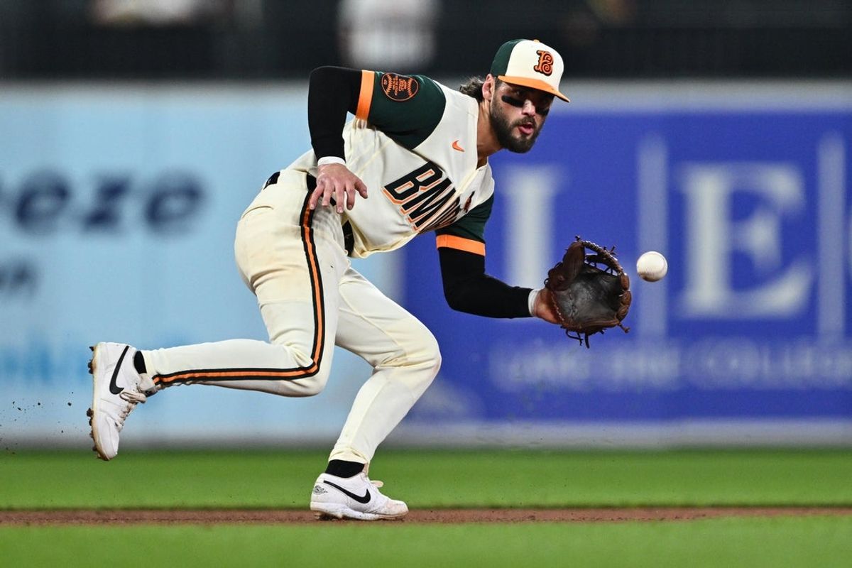 Jul 10, 2026; Baltimore, Maryland, USA;  Baltimore Orioles infielder Blaze Alexander (23) fields a ground ball in the seventh inning against the Kansas City Royals at Oriole Park at Camden Yards. Mandatory Credit: Jamie Sabau-Imagn Images