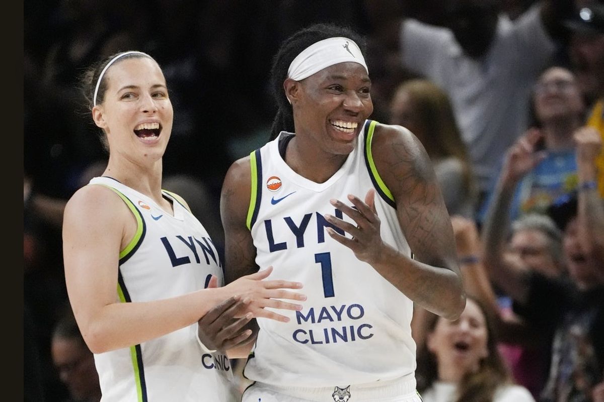 Jul 11, 2026; Minneapolis, Minnesota, USA; Minnesota Lynx forward Natasha Howard (1) celebrates her buzzer beater basket against the New York Liberty with guard Antonia Delaere (8) after the first quarter at Target Center. Mandatory Credit: Bruce Kluckhohn-Imagn Images
