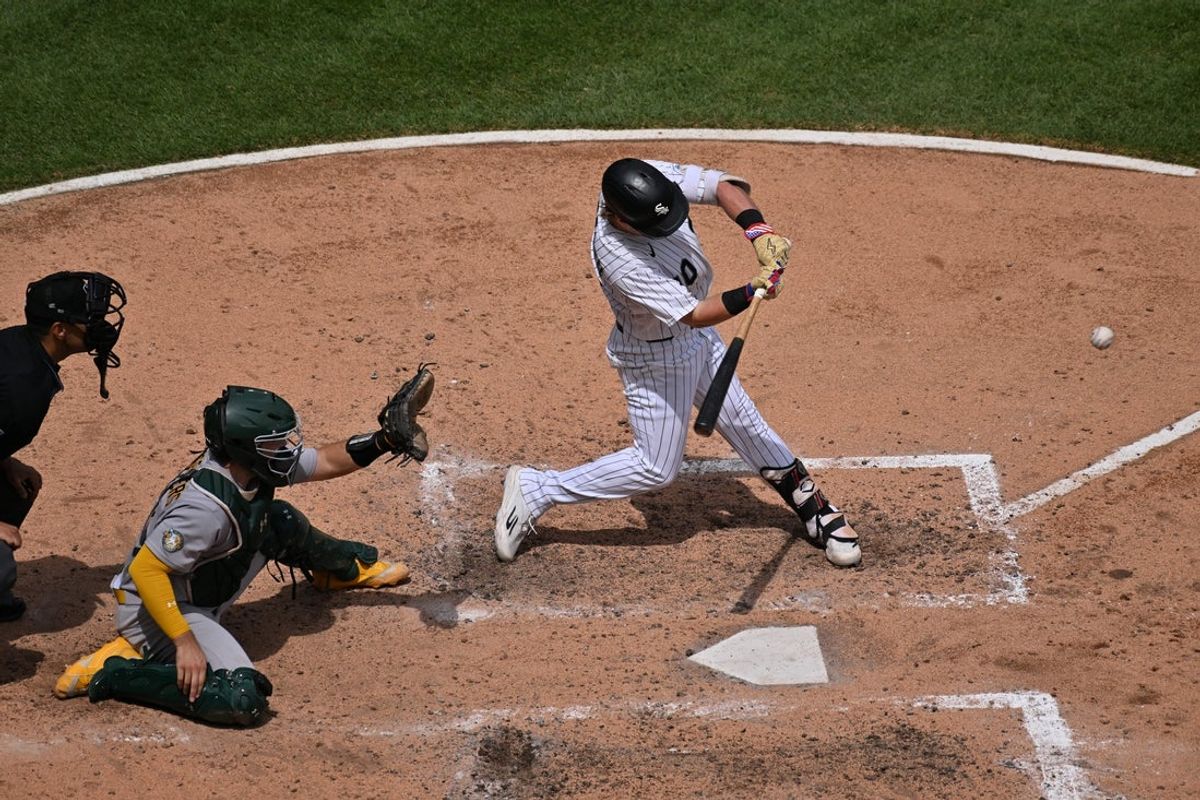 Jul 11, 2026; Chicago, Illinois, USA; Chicago White Sox second baseman Chase Meidroth (10) hits an RBI double against the Athletics during the sixth inning at Rate Field. Mandatory Credit: Patrick Gorski-Imagn Images
