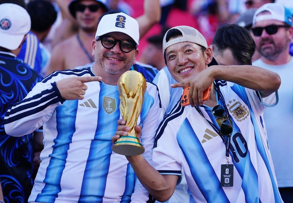 Argentina fans with replica World Cup trophy inside the stadium in Kansas City.