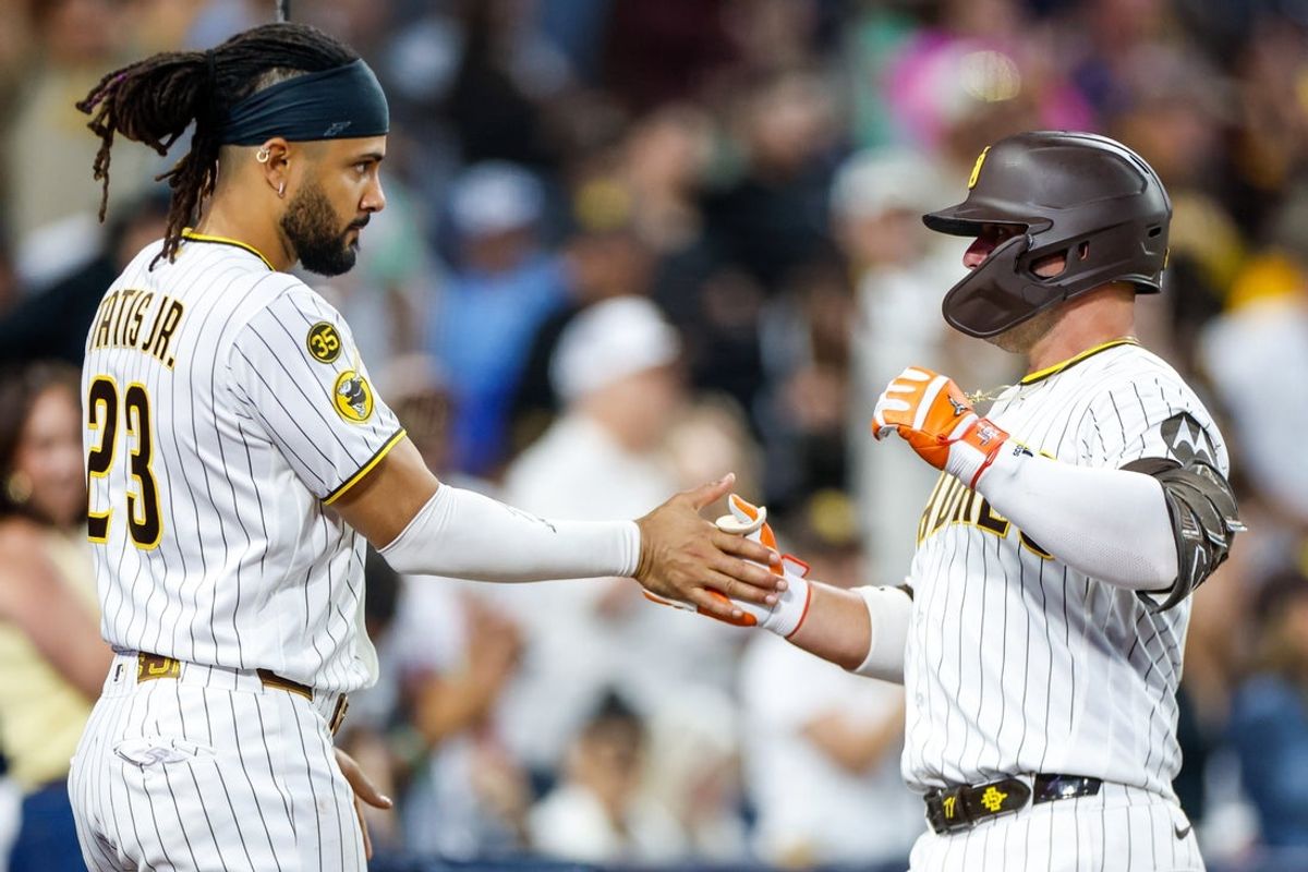 Jul 11, 2026; San Diego, California, USA; San Diego Padres first baseman Ty France (25) celebrates with right fielder Fernando Tatis Jr. (23) after hitting a home run during the sixth inning against the Toronto Blue Jays at Petco Park. Mandatory Credit: David Frerker-Imagn Images