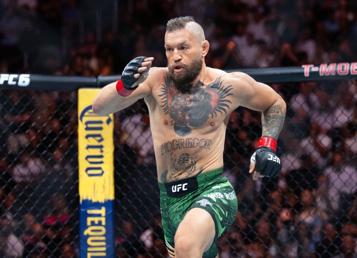 Jul 11, 2026; Las Vegas, Nevada, USA; Conor McGregor runs to Max Holloway (not pictured) during UFC 329 at T-Mobile Arena. Mandatory Credit: Mark J. Rebilas-Imagn Images