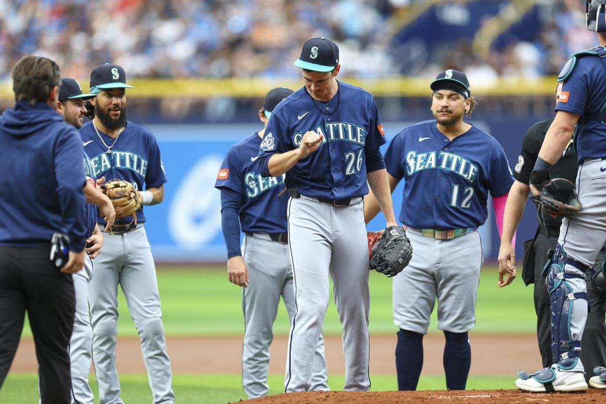 Jul 12, 2026; St. Petersburg, Florida, USA; Seattle Mariners starting pitcher Emerson Hancock (26) reacts after being hit by a ball against the Tampa Bay Rays in the first inning at Tropicana Field. Mandatory Credit: Nathan Ray Seebeck-Imagn Images