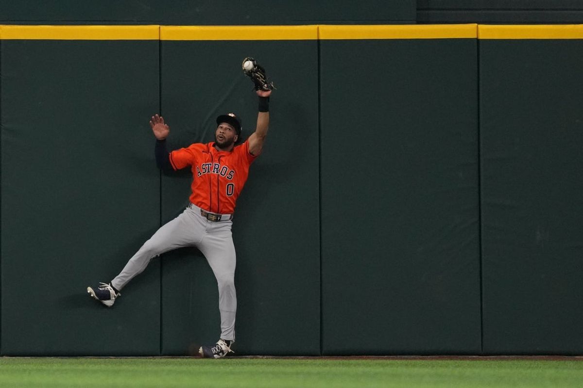 Jul 12, 2026; Arlington, Texas, USA;  Houston Astros center fielder Brice Matthews (0) is unable to make the catch of a fly ball against the Texas Rangers during the first inning at Globe Life Field. Mandatory Credit: Raymond Carlin III-Imagn Images