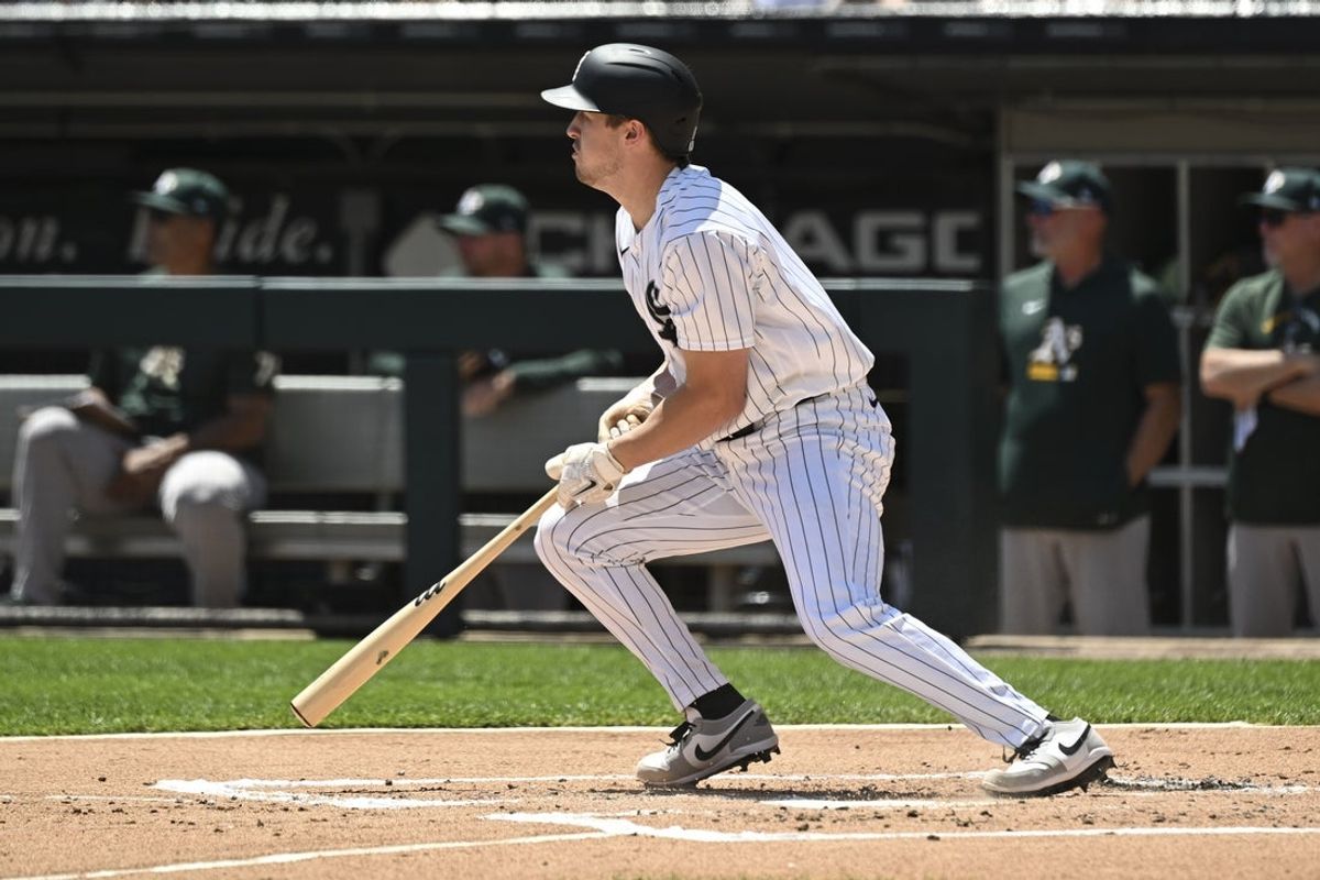 Jul 12, 2026; Chicago, Illinois, USA;  Chicago White Sox catcher Kyle Teel (8) hits a two-RBI single against the Athletics during the first inning at Rate Field. Mandatory Credit: Matt Marton-Imagn Images