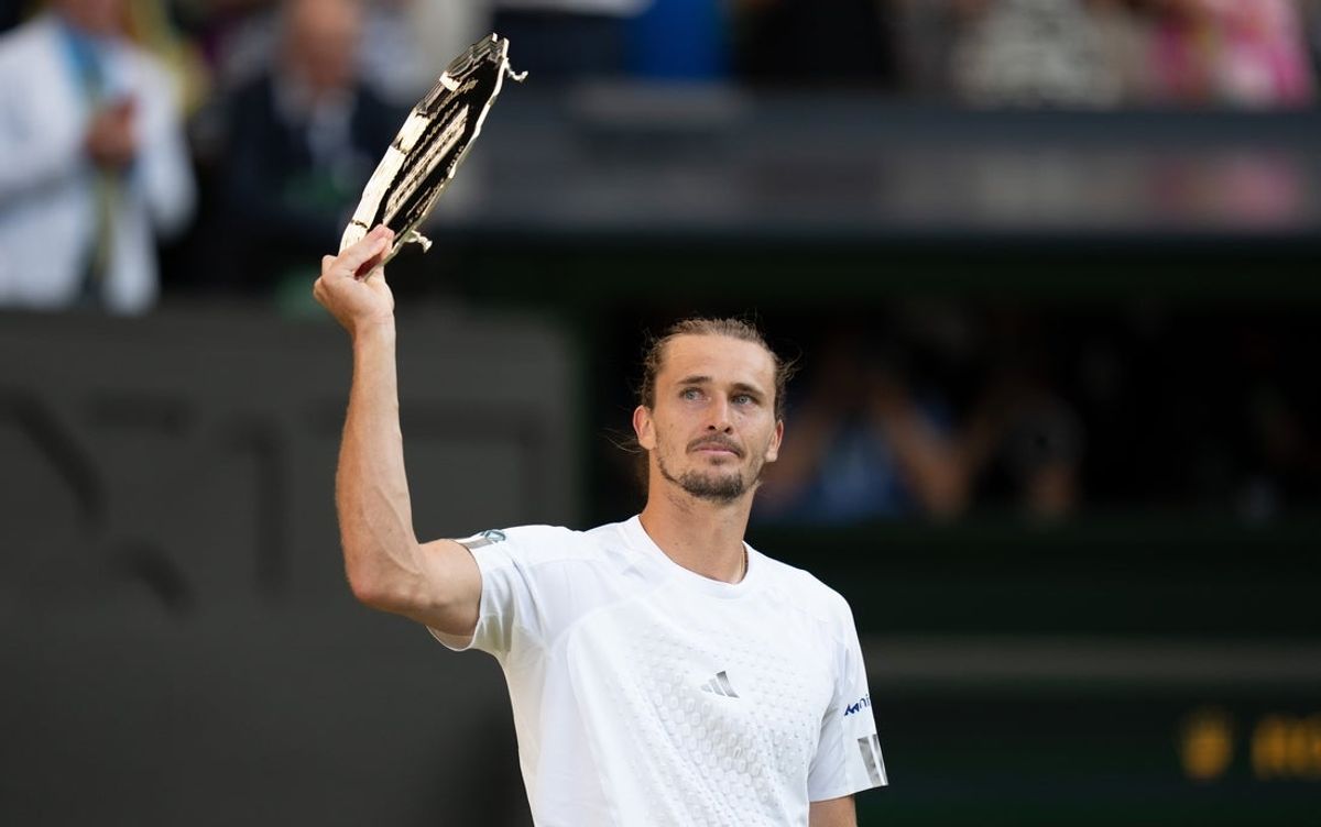 Jul 12, 2026; London, United Kingdom; Alexander Zverev of Germany holds up the finalist trophy after the men’s singles final against Jannik Sinner of Italy on day 14 at All England Lawn Tennis and Croquet Club.  Mandatory Credit: Susan Mullane-Imagn Images