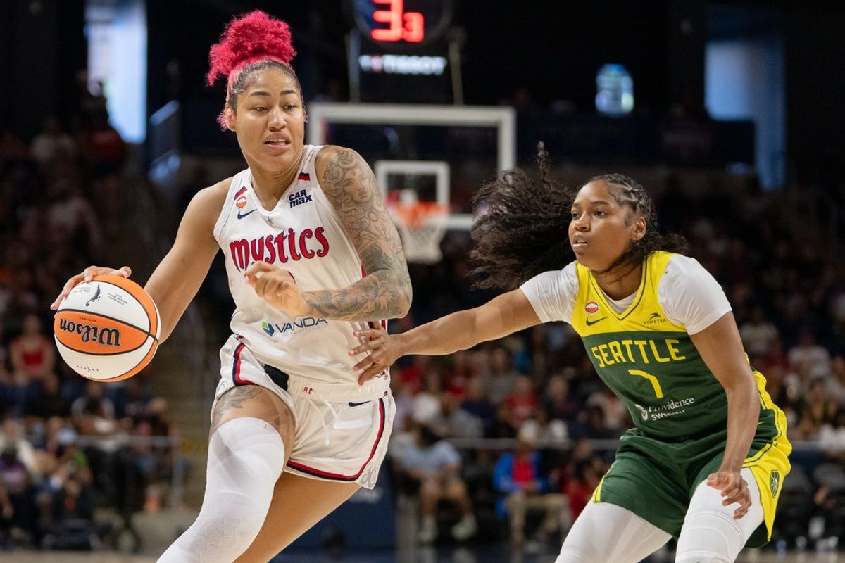 Jul 12, 2026; Washington, District of Columbia, USA; Washington Mystics Center Shakira Austin (0) drives past Seattle Storm Guard Zia Cooke (7) at CareFirst Arena. Mandatory Credit: Jamie LeBlanc-Imagn Images