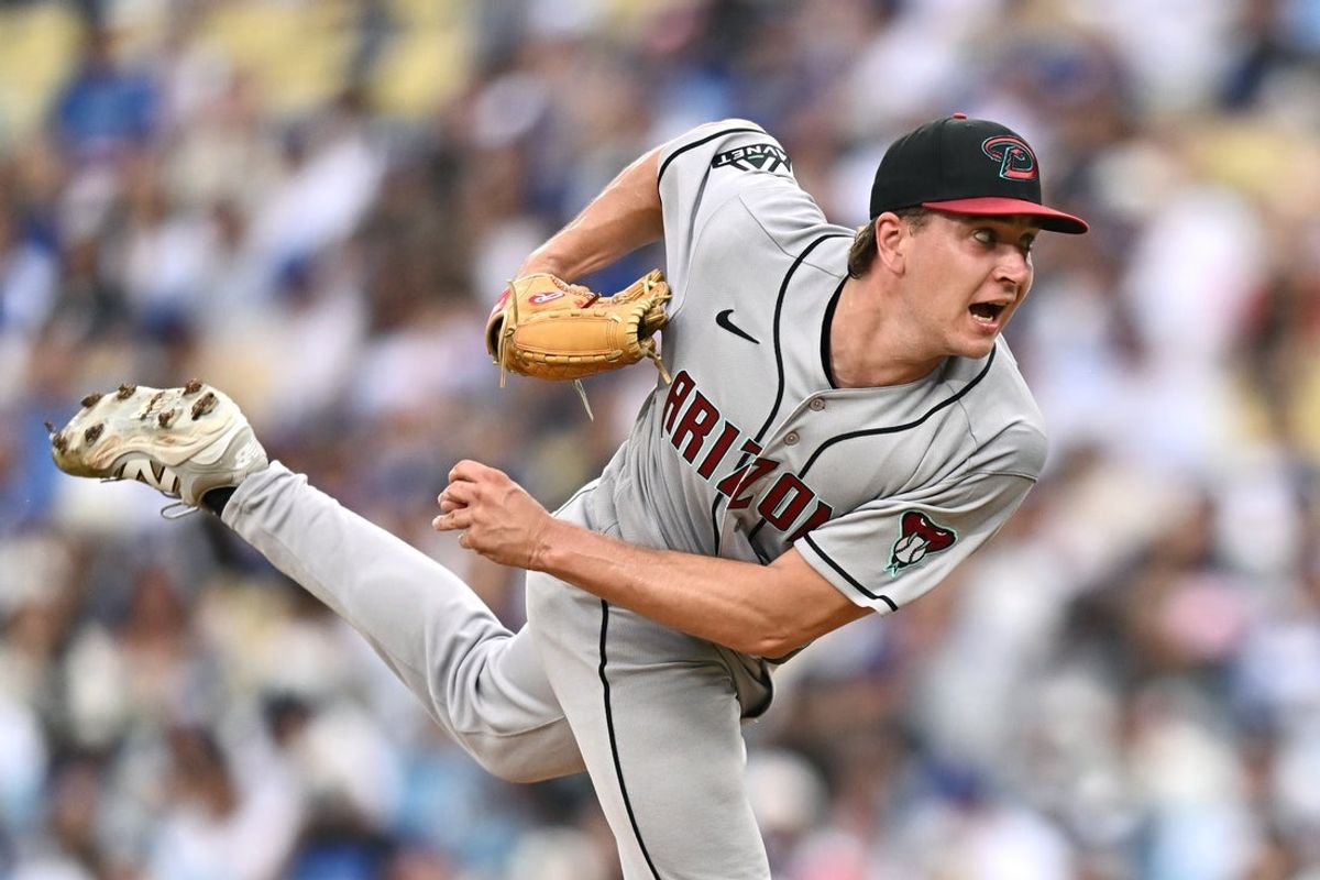 Jul 12, 2026; Los Angeles, California, USA; Arizona Diamondbacks pitcher Mitch Bratt (60) pitches against the Los Angeles Dodgers during the third inning at Dodger Stadium. Mandatory Credit: William Liang-Imagn Images
