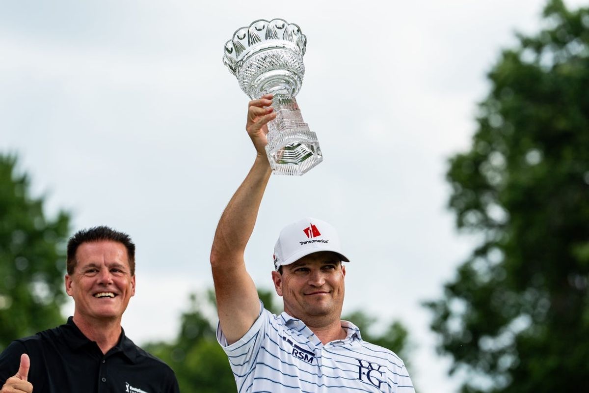 Zach Johnson hoits the Gary Player Cup alongside Matt Kaulig after winning the Kaulig Companies PGA Championship Final Round, July 12, 2026, at Firestone Country Club in Akron, Ohio.
