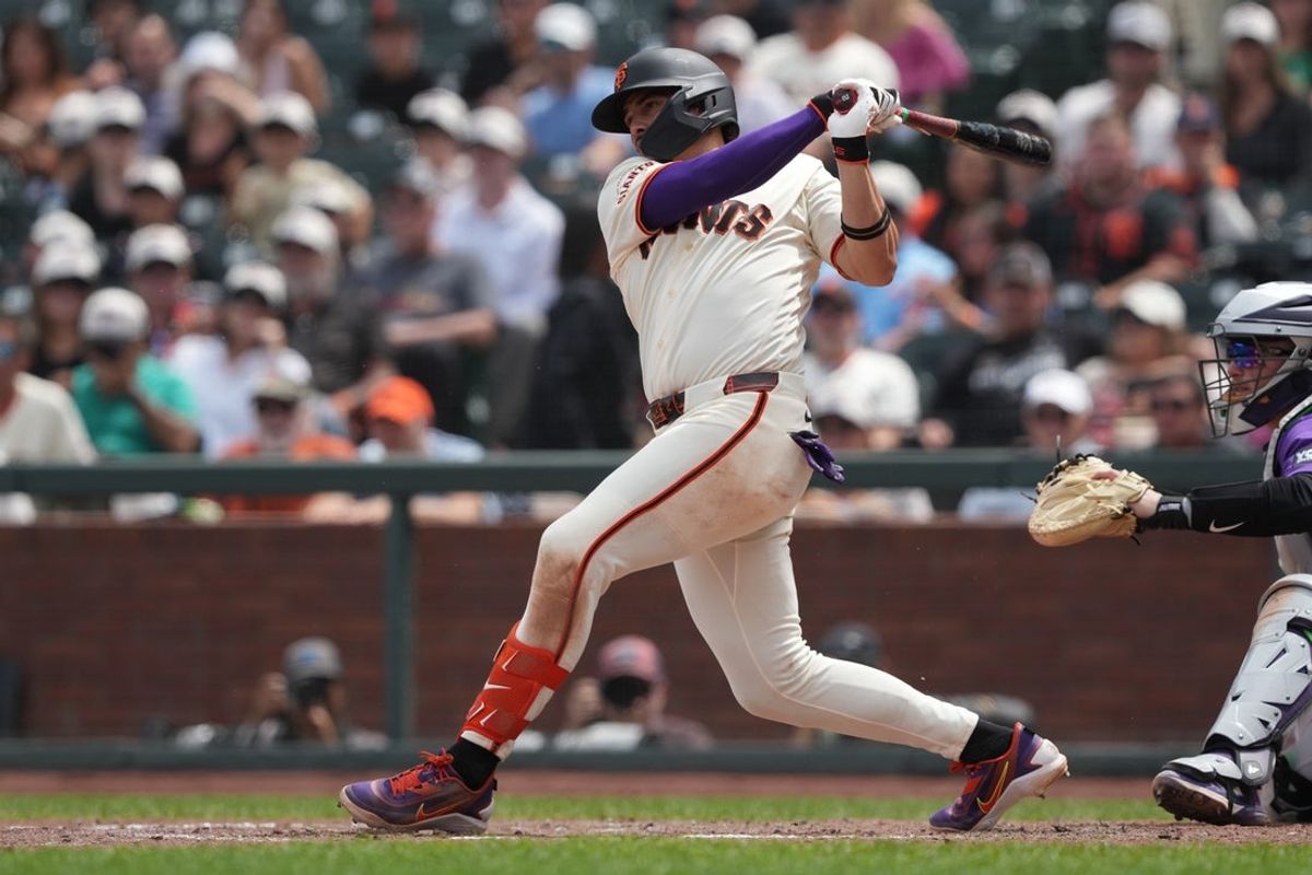 Jul 12, 2026; San Francisco, California, USA; San Francisco Giants shortstop Willy Adames (2) hits an RBI single against the Colorado Rockies during the eighth inning at Oracle Park. Mandatory Credit: Darren Yamashita-Imagn Images
