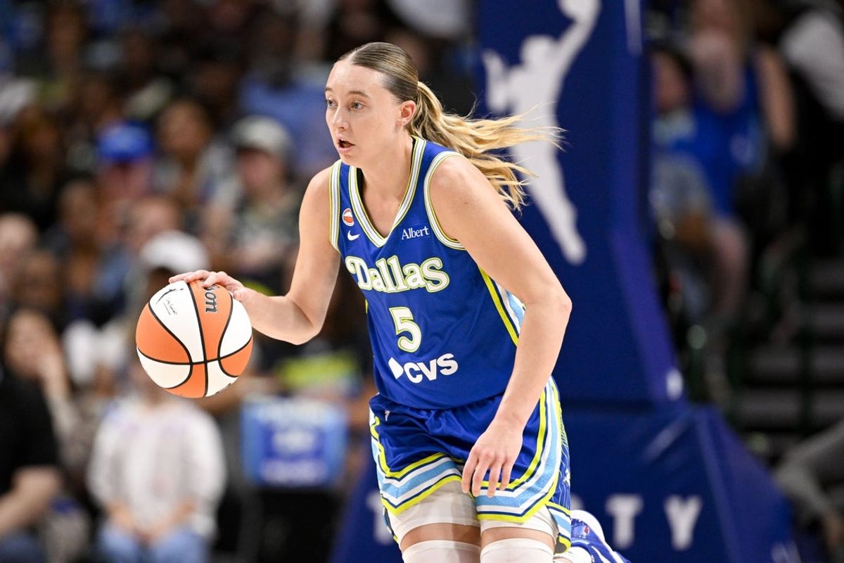 Jul 12, 2026; Dallas, Texas, USA; Dallas Wings guard Paige Bueckers (5) brings the ball up court against the Chicago Sky during the first half at the American Airlines Center. Mandatory Credit: Jerome Miron-Imagn Images