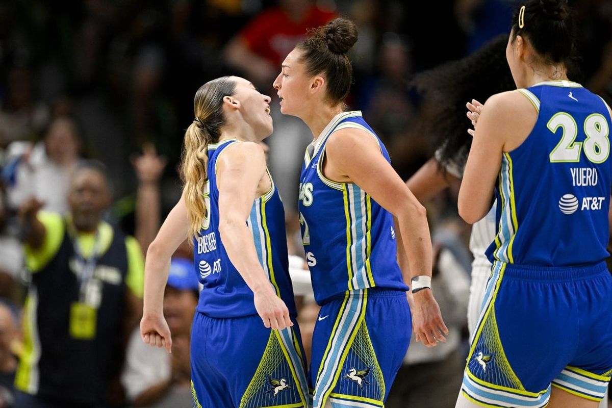 Jul 12, 2026; Dallas, Texas, USA; Dallas Wings guard Paige Bueckers (5) and forward Jessica Shepard (32) celebrate during the second half at the American Airlines Center. Mandatory Credit: Jerome Miron-Imagn Images
