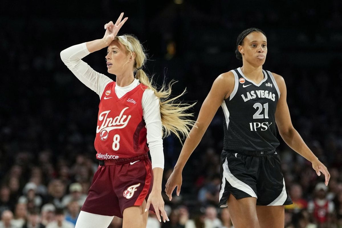 Jul 12, 2026; Las Vegas, Nevada, USA; Indiana Fever guard Sophie Cunningham (8) reacts after scoring against Las Vegas Aces forward-center Brianna Turner (21) during the first quarter of a WNBA basketball game at Michelob Ultra Arena. Mandatory Credit: Lucas Peltier-Imagn Images