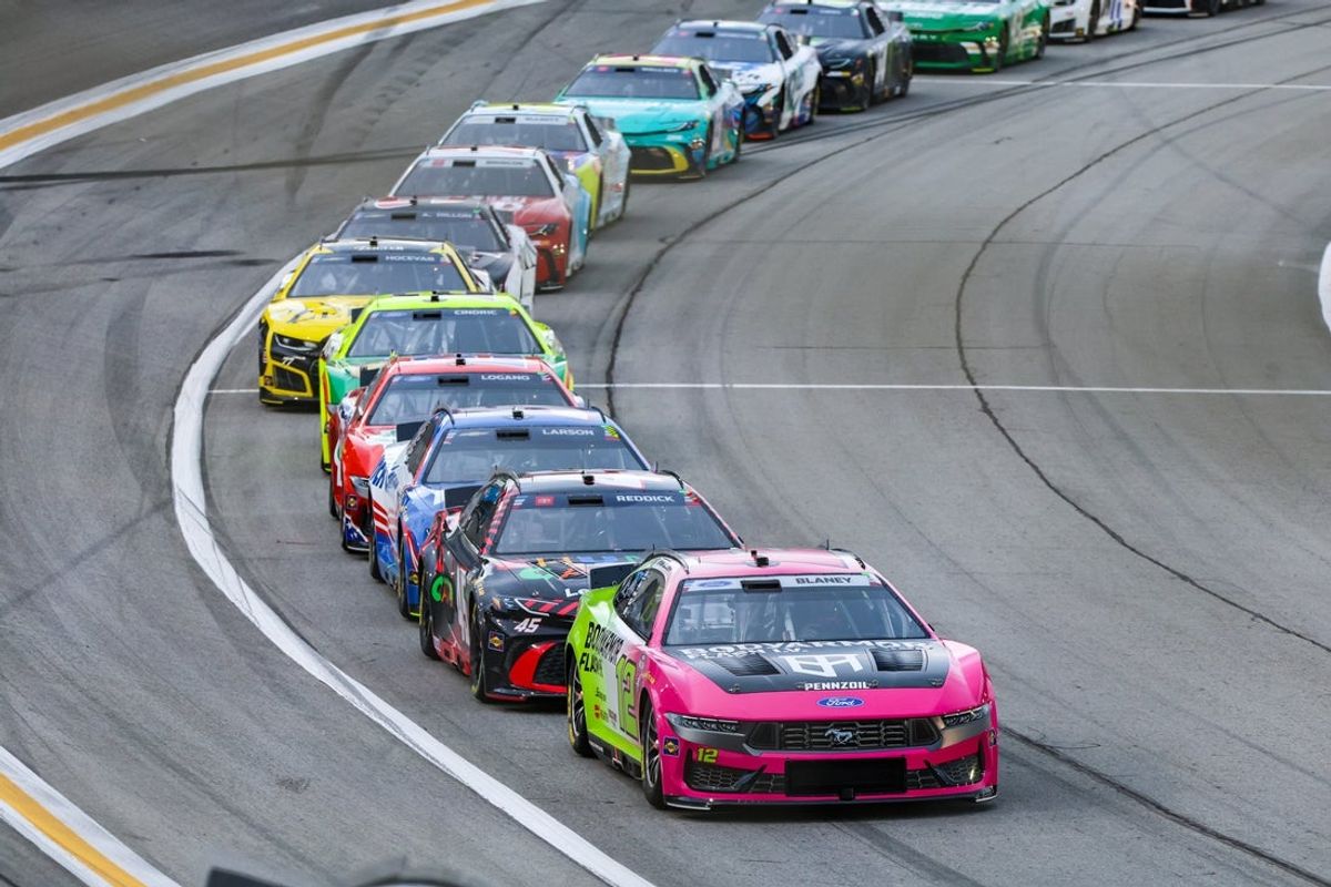 Jul 12, 2026; Hampton, Georgia, USA; Body Armor Flash I.V. driver Ryan Blaney (12), Chumba Casino driver Tyler Reddick (45), HendrickCars.com driver Kyle Larson (5), Hunt Brothers Pizza driver Joey Logano (22) race during the Quaker State 400 at EchoPark Speedway. Mandatory Credit: Jordan Godfree-Imagn Images