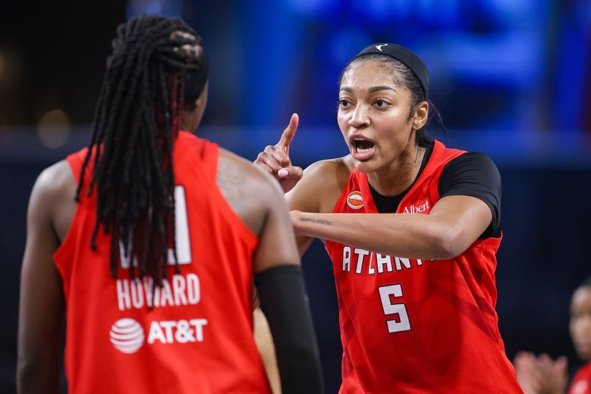 Jul 13, 2026; College Park, Georgia, USA; Atlanta Dream forward Angel Reese (5) celebrates after a basket by guard Rhyne Howard (10) against the Los Angeles Sparks in the fourth quarter at Gateway Center Arena at College Park. Mandatory Credit: Brett Davis-Imagn Images