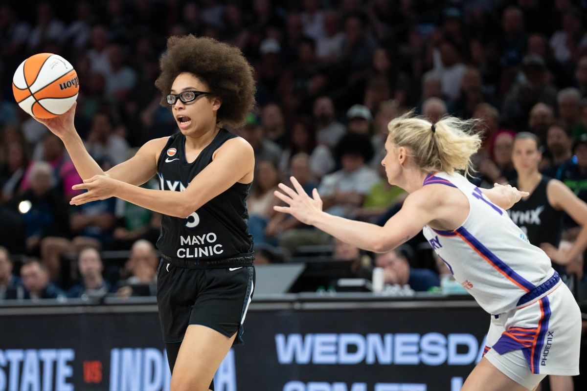 Jul 13, 2026; Minneapolis, Minnesota, USA; Minnesota Lynx guard Olivia Miles (5) dribbles the ball past Phoenix Mercury guard Lexi Held (10) in the first half at Target Center. Mandatory Credit: Jesse Johnson-Imagn Images