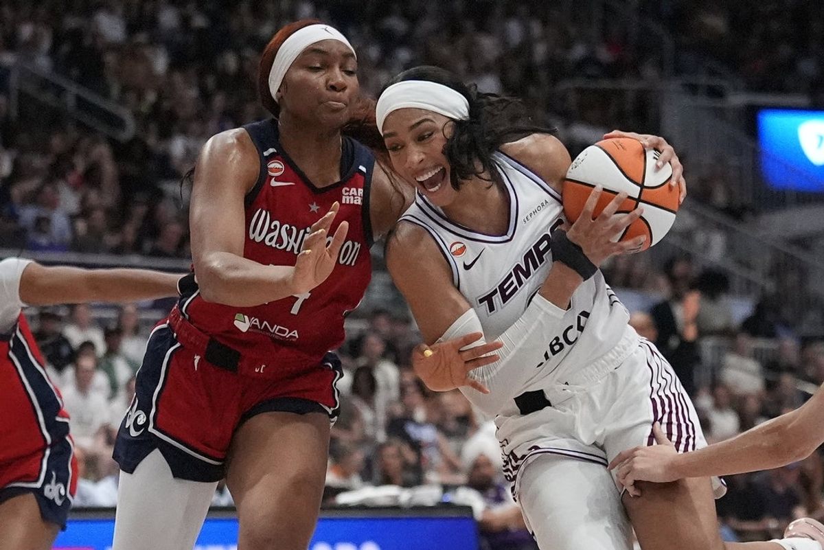 Jul 14, 2026; Toronto, Ontario, CAN; Toronto Tempo forward Isabelle Harrison (21) dribbles the ball past Washington Mystics forward Kiki Iriafen (44) during the second half at Coca-Cola Coliseum. Mandatory Credit: John E. Sokolowski-Imagn Images