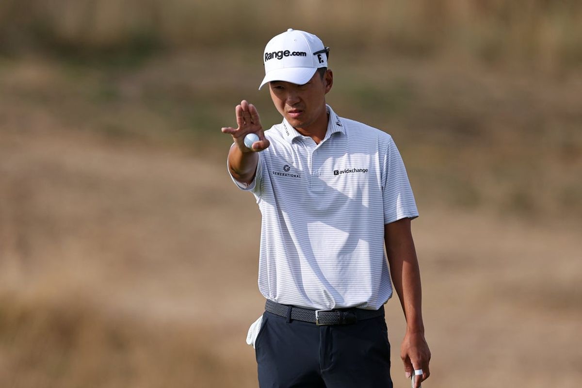 Jul 16, 2026; Southport, ENG; Michael Kim lines up a putt on the eighth green during the first round of The Open Championship golf tournament at Royal Birkdale. Mandatory Credit: Bill Streicher-Imagn Images