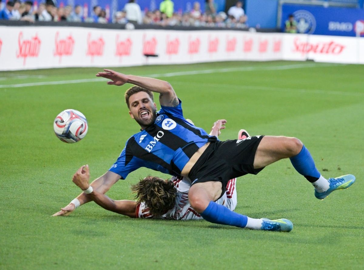 Jul 16, 2026; Montreal, Province of Quebec, CAN; Toronto FC forward Theo Corbeanu (7) and CF Montreal defenseman Luca Petrasso (13) battle for the ball during the first half at Saputo Stadium. Mandatory Credit: Eric Bolte-Imagn Images