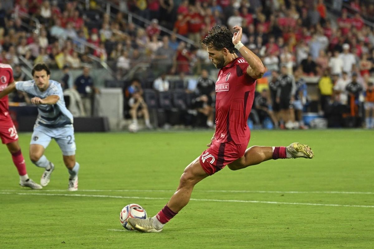 Jul 16, 2026; St. Louis, Missouri, USA; St. Louis CITY SC midfielder Eduard Lowen (10) scores on a penalty kick against Sporting Kansas City in the second half at Energizer Park. Mandatory Credit: Joe Puetz-Imagn Images