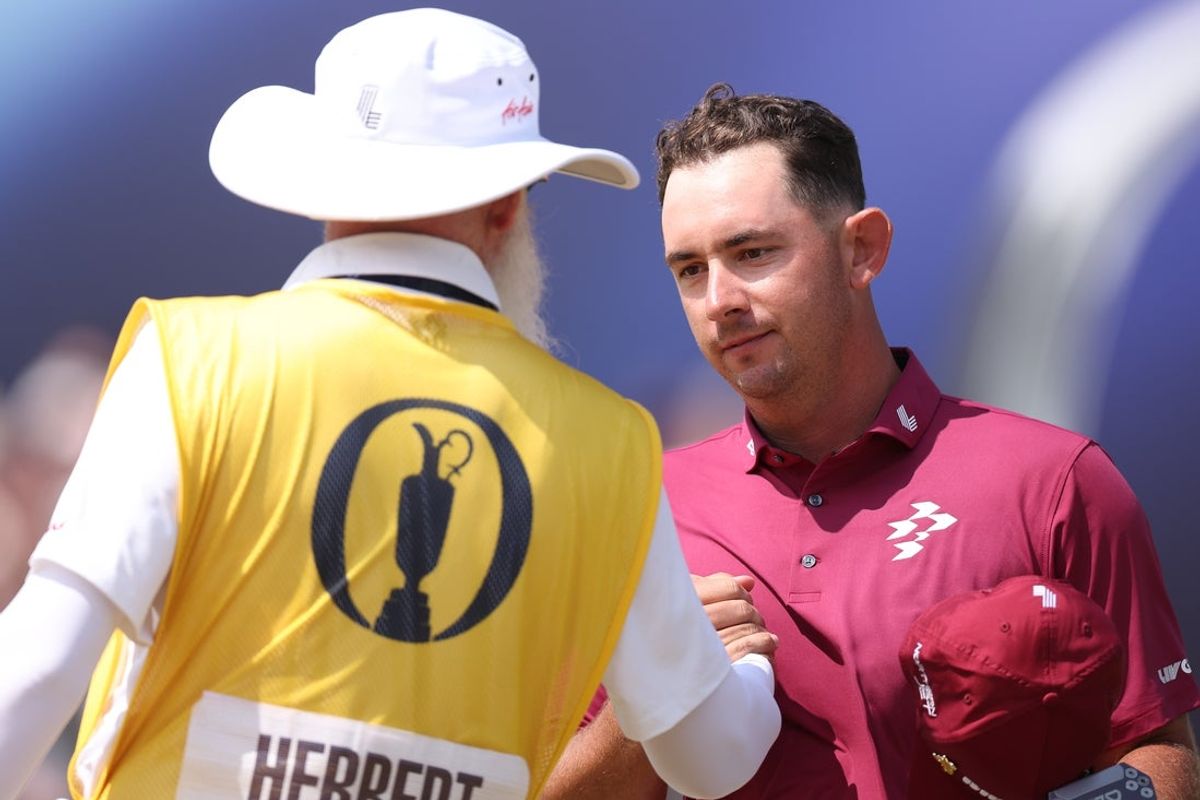 Jul 17, 2026; Southport, ENG;  Lucas Herbert shakes the hand of his caddie, Nick Pugh, following his round of during the second round of The Open Championship golf tournament at Royal Birkdale. Mandatory Credit: Bill Streicher-Imagn Images
