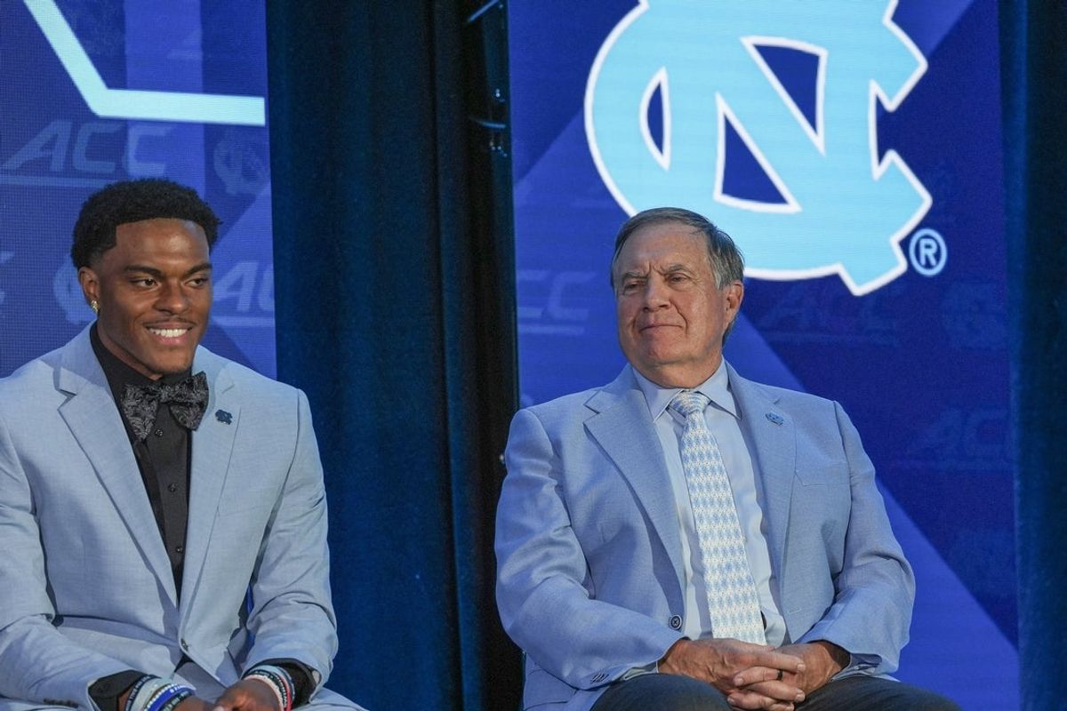Jul 17, 2026; Charlotte, NC, USA; North Carolina wide reciever Jordan Shipp and  head coach Bill Belichick react during a moment with the media during interviews at Hilton Charlotte Uptown. Mandatory Credit: Jim Dedmon-Imagn Images