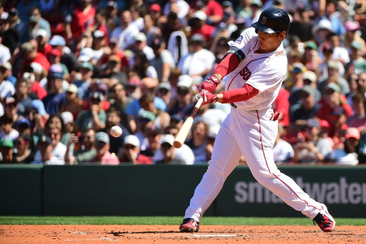 Jul 17, 2026; Boston, Massachusetts, USA;  Boston Red Sox designated hitter Masataka Yoshida (7) hits a single during the sixth inning against the Tampa Bay Rays at Fenway Park. Mandatory Credit: Bob DeChiara-Imagn Images