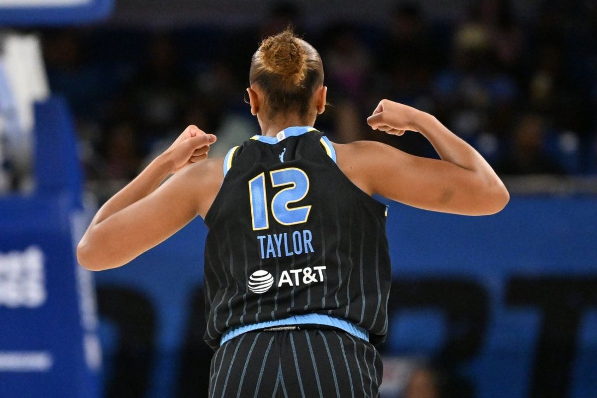 Jul 17, 2026; Chicago, Illinois, USA; Chicago Sky guard Sydney Taylor (12) flexes during the second half against the Los Angeles Sparks at Wintrust Arena. Mandatory Credit: Patrick Gorski-Imagn Images