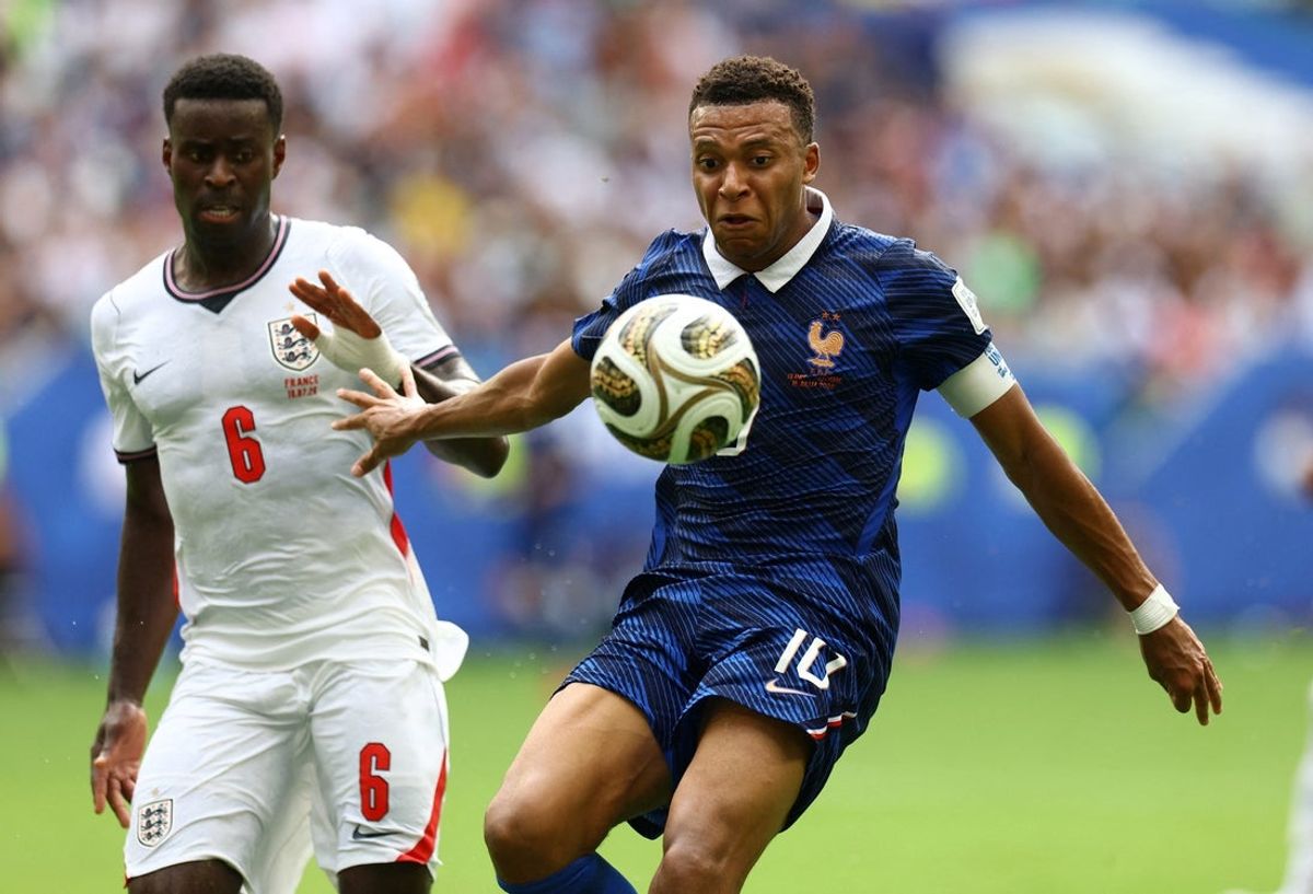 July 18, 2026; Miami Gardens, Florida, U.S.; France's Kylian Mbappe in action with England's Marc Guehi.  Mandatory Credit: Nathan Ray Seebeck-Imagn Images
