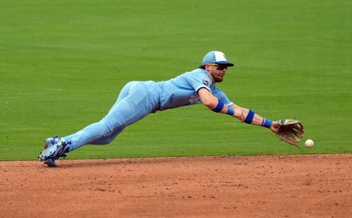 Jul 18, 2026; Kansas City, Missouri, USA; Kansas City Royals shortstop Bobby Witt Jr. (7) makes a diving stop during the third inning against the San Diego Padres at Kauffman Stadium. Mandatory Credit: Jay Biggerstaff-Imagn Images