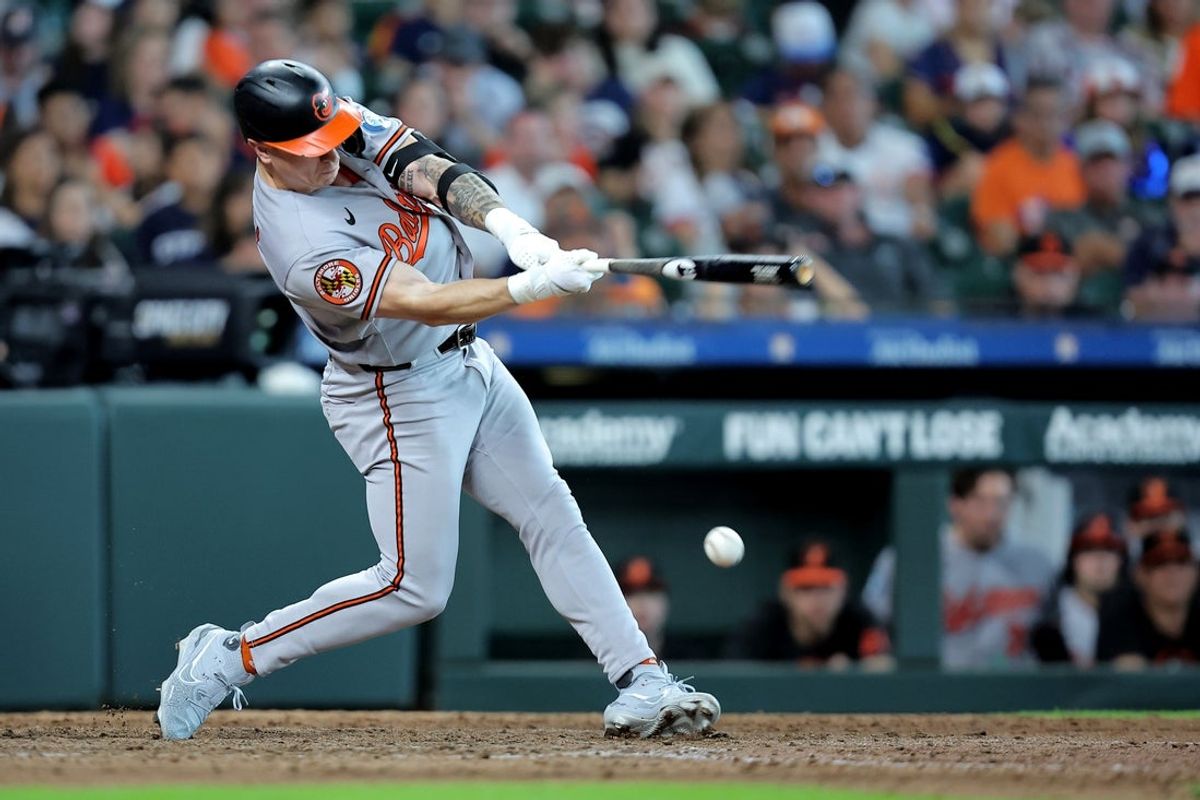 Jul 18, 2026; Houston, Texas, USA; Baltimore Orioles right fielder Tyler O'Neill (9) hits an RBI infield single against the Houston Astros during the 11th inning at Daikin Park. Mandatory Credit: Erik Williams-Imagn Images